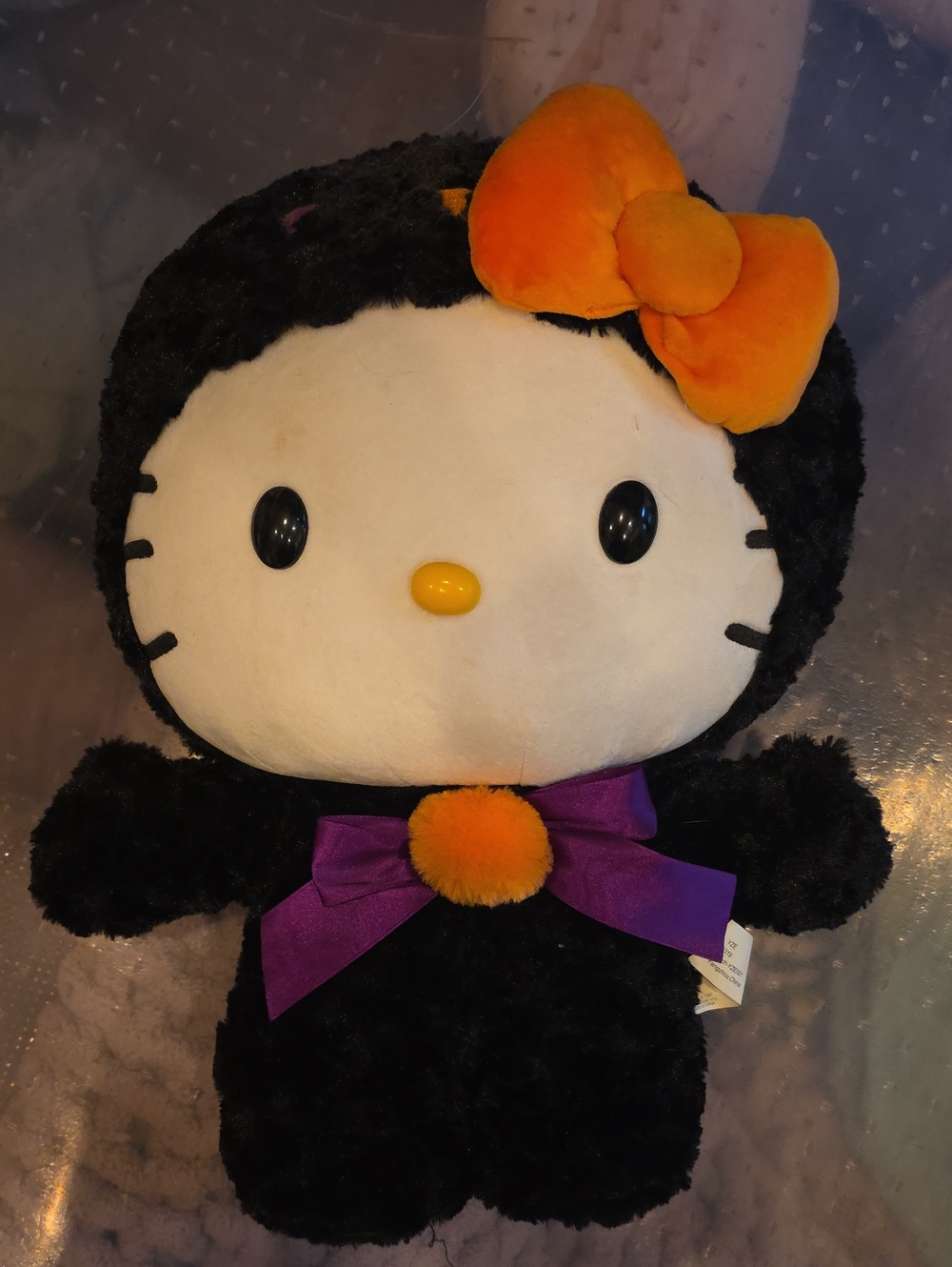 Black Plush Kitty Toy with Orange Bow and Purple Ribbon